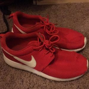 Red Nike tennis shoes